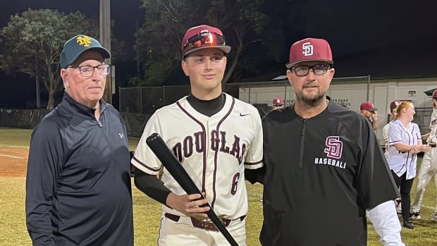 Niko Benestad (center) was named MVP photo BCAA Tournament. He posed with Pat McQuaid (left) and Stoneman Douglas head coach Todd Fitz-Gerald. (3/1/2024)